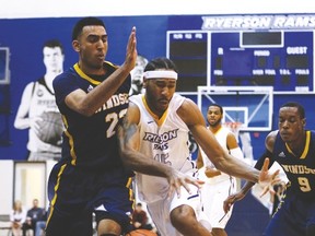 Ryerson Rams’ Kadeem Green battles for a loose ball against Tyler Persaud of the Windsor Lancers during last night’s OUA semifinal at the raucous Coca-Cola Court. The Rams will face Carleton tonight for the OUA championship. (CRAIG ROBERTSON, Toronto Sun)