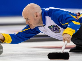 Alberta skip Kevin Koe delivers a rock on March 10, 2016, at the Tim Hortons Brier in Ottawa. His team will play in the Page Playoff 3-4 game on March 12, 2016, against Mike McEwen’s Manitoba team. Alberta will have last rock in the first end. (ERROL McGIHON/Postmedia Network)