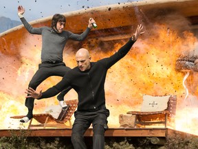 This image released by Sony Pictures shows Sacha Baron Cohen, left, and Mark Strong in Columbia Pictures' "The Brothers Grimsby." (Daniel Smith/Sony Pictures via AP)