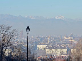 A view of the Italian city of Turin, with the Alps mountains in background is seen in this Monday, Dec. 28, 2015 file photo. (Alessandro Di Marco/ANSA via AP)