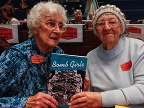 96  year old Irene Vasey on the left with 94 year old Marguerite Strama at Council Chambers at Toronto City Hall. Both women were bomb girls during the war where they worked 24-7 in great secrecy at the GE CO Ammunitions Plant at Warden Ave. and Eglinton Ave. East during the war.They are holding up a book written by Barbara Dickson on the work all the women did during the war.on Tuesday March 8, 2016. Dave Thomas/Toronto Sun/Postmedia Network