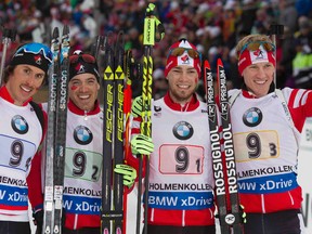 Canadas men's relay team of (from left) Brendan Green, Nathan Smith and Christian Gow celebrate after winning a bronze medal at the IBU World Championships in Oslo, Norway on March 12, 2016. (www.nordicfocus.com/NordicFocus)
