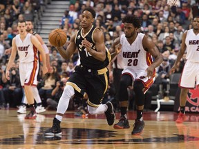 Toronto Raptors guard DeMar DeRozan battles for a ball with Miami Heat forward Justise Winslow during the second quarter in a game at Air Canada Centre. (Nick Turchiaro/USA TODAY Sports)