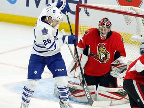 Toronto Maple Leafs' Ben Smith attempts to deflect the puck past Ottawa Senators goalie Craig Anderson in the first period in Ottawa Saturday night.