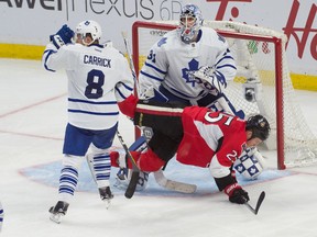 Senators winger Chris Neil is upended in front of the Maple Leafs' net on Saturday night in Ottawa. The Senators won 4-0. (USA TODAY Sports)