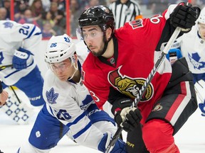 Toronto Maple Leafs winger Ben Smith battles with Senators centre Mika Zibanejad during the second period at the Canadian Tire Centre on March 12. (USA Today Sports)
