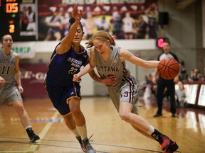 Ottawa Gee-Gees’ Catharine Traer drives on Silvana Jaz of the Ryerson Rams in the OUA final. (Submitted photo)
