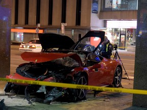 A Ferrari is damaged after a two-car crash at Yonge and Eglinton Saturday, March 12, 2016 also injured a pedestrian. (Andrew Collins/Special to the Toronto Sun)
