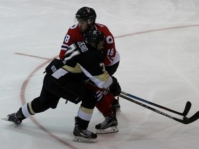 Sarnia Legionnaires defenceman Brett Storr checks Manny Silverio of the LaSalle Vipers during Game 6 of the Greater Ontario Junior Hockey League Western Conference quarter-final at Sarnia Arena on Saturday, March 12, 2016 in Sarnia, Ont. LaSalle won 5-4 in overtime to force Game 7. Terry Bridge/Sarnia Observer/Postmedia Network