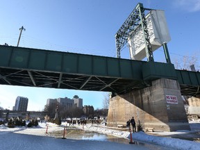 Puddles have been visible for a while on the now-closed Red River Mutual Trail at The Forks but Winnipeg is set to get a bit colder in a few days. (Winnipeg Sun/Postmedia Network)