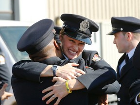 Toronto Fire Services recruits celebrate their graduation on Thursday March 12, 2015. (Michael Peake/Toronto Sun)
