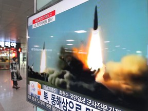 A TV screen shows footage of the missile launch conducted by North Korea, at Seoul Railway Station in Seoul, South Korea, Thursday, March 10, 2016. (AP Photo/Ahn Young-joon)