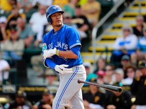 Toronto Blue Jays second baseman Ryan Goins walks with bases loaded to get an RBI during the second inning against the Pittsburgh Pirates at McKechnie Field. (Kim Klement/USA TODAY Sports)
