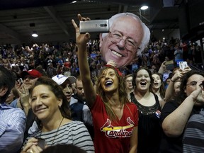 Supporters of U.S. Democratic presidential candidate Bernie Sanders cheer during a rally at Affton High School in St. Louis, Missouri March 13, 2016. (REUTERS/Shannon Stapleton)