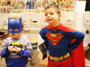 Ian Teskey, 2, and Max Teskey, 5, did their superhero-best during Sunday's Pop Culture show held at the Holiday Inn in Point Edward. The fourth annual event attracted approximately 1,000 people. (Neil Bowen, Sarnia Observer)