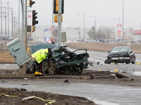 Police investigate at the scene of a fatal car crash along northbound Manning Drive near 50 Street, in Edmonton Alta. on Sunday March 13, 2016. David Bloom