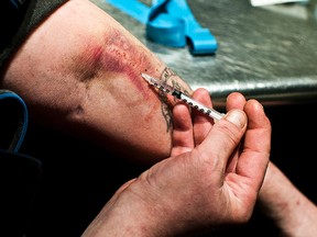 A drug user at a safe-injection site in Vancouver. (Toronto Sun files)