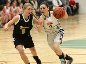 Aly McEwen, right, of Sudbury Jam, drives to the basket against Kameryn Elkin, of the Parry Sound Stingers, during action at a Jam basketball tournament at College Boreal in Sudbury, Ont. on Saturday March 12, 2016. John Lappa/Sudbury Star/Postmedia Network