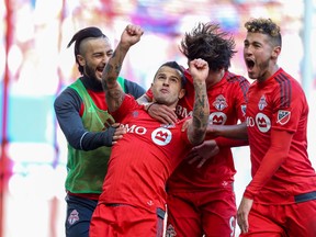 Toronto FC forward Sebastian Giovinco celebrates his goal against the New York Red Bulls during the second half at Red Bull Arena. (Vincent Carchietta/USA TODAY Sports)