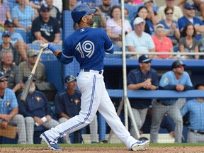 Toronto Blue Jays outfielder  Jose Bautista hits a three run home run in the third inning of the spring training game against the Tampa Bay Rays  at Florida Auto Exchange Park. (Jonathan Dyer/USA TODAY Sports)