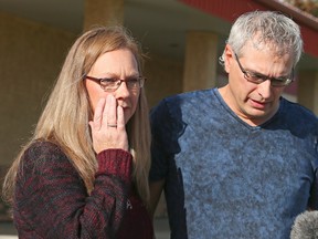 Roger and Bonita Bott make a statement to the media at the Withrow Gospel Mission in Withrow, Alberta, Wednesday, October 21, 2015. Their children Catie, 13, Dara, 11, and Jana, 11, were playing on a truck loaded with canola on October 13 when they were buried by the seed. (THE CANADIAN PRESS/Mike Ridewood)