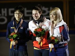 Gold medalist Marianne St-Gelais, center, of Canada poses with silver medalist Choi Minjeong, left, of South Korea and bronze medalist Elise Christie of Britain during the awarding ceremony of the women's 1500 meter final at the ISU World Cup Short Track Speed Skating in Seoul, South Korea, Saturday, March 12, 2016. (AP Photo/Ahn Young-joon)
