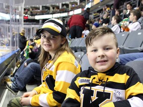 Mackenzi and Zander Jones take in some Ontario Hockey League Action as the Kingston Frontenacs  take on the Ottawa 67's at the Rogers KRock Centre in Kingston, Ont. on Saturday March 12, 2016. Steph Crosier/Kingston Whig-Standard/Postmedia Network