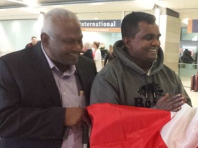 Colin Jayantha Perera, 65, left, greets nephew Lasantha Bandara, 40, at the Ottawa airport after he arrived from Sri Lanka to donate one of his kidneys to his uncle. MEGAN GILLIS / POSTMEDIA