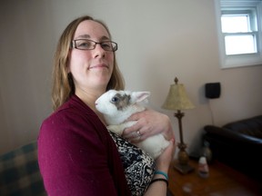 Kaylie MacIntosh, head of London?s only all-rabbit rescue, Hoppy Hearts, holds Pebbles, a dwarf-type rabbit. (CRAIG GLOVER, The London Free Press)