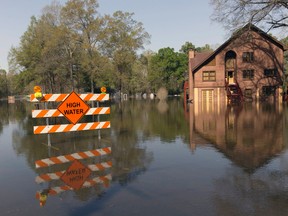 A sign marks high water in a flooded section of in Oil City, La., Sunday, March 13, 2016. President Barack Obama has signed an order declaring Louisiana's widespread flooding from heavy rains a major disaster. (Lee Celano/The Shreveport Times via AP)