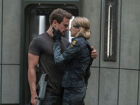 This image released by Lionsgate shows Shailene Woodley, right, and Theo James in a scene from "The Divergent Series: Allegiant." (Murray Close/Lionsgate via AP)