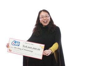 Mississauga's Zhe Wang shows off her $64-million cheque for winning the Oct. 17, 2015 Lotto 6/49 draw.