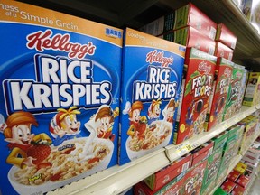 In a Wednesday, July 18, 2012, file photo, Kellogg's cereals are on display at a Pittsburgh grocery market. Kellogg says a criminal investigation is underway after a video surfaced online showing a man urinating on one of its factory assembly lines. (AP Photo/Gene J. Puskar, File)