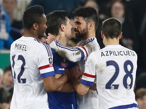 Chelsea's Diego Costa clashes with Everton's Gareth Barry before being sent off. (Reuters / Phil Noble)