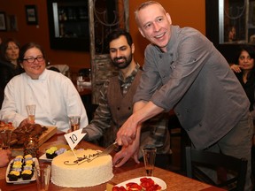 Tim Miller/The Intelligencer
Roy Pennell, co-owner of Portabella, cuts the cake at the tenth annual Countylicious kick-off on Monday in Picton.