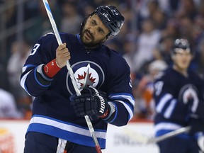 Winnipeg Jets defenceman Dustin Byfuglien may or may not play against Vancouver on Monday night. (Kevin King/Winnipeg Sun file photo)