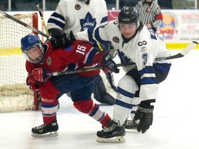 Strathroy Rocket Max Ewart and London National Derek Di Iorio tangle up during their Greater Ontario Junior Hockey League game at Western Fair Sports Centre on March 9. (DEREK RUTTAN, The London Free Press)