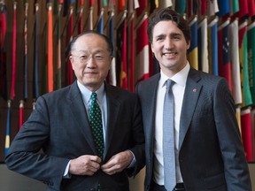 Prime Minister Justin Trudeau is welcomed to the World Bank by its president Jim Yong Kim Friday, March 11, 2016 in Washington. THE CANADIAN PRESS/Paul Chiasson