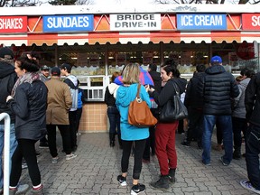 A long lineup on the opening day at the Bridge Drive-In on Jubilee Avenue on Saturday. Temperature records fell again on Monday in Winnipeg and other southern Manitoba locales. (Kevin King/Winnipeg Sun file photo)