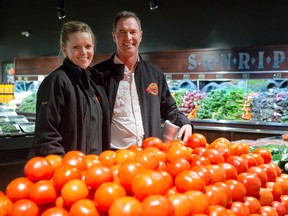 Owners Will and Ingrid Willemsen stand in the fresh produce section of their new Sunripe Marketplace grocery store in northwest London. (CRAIG GLOVER, The London Free Press)