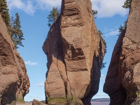 The flowerpot rock known as Elephant Rock formation is shown before it's collapse, in Hopewell Cape, N.B., in this October 29, 2013, handout photo. THE CANADIAN PRESS/HO - Kevin Snair