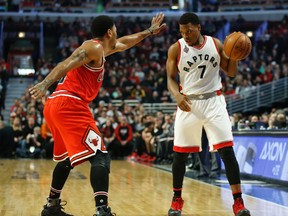 Bulls guard Derrick Rose (left) defends against Raptors guard Kyle Lowry (right) during NBA action in Chicago on Feb. 19, 2016. (Kamil Krzaczynski/USA TODAY Sports)