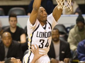 London Lightning guard Marcus Patterson dunks over Eric Fredrick of the Windsor Express during their NBL game in London, Ont. on Friday February 19, 2016. (DEREK RUTTAN, The London Free Press)