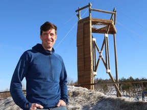 Jim Little, co-ordinator of the Outdoor Adventure Leadership program at Laurentian University, stands in front of a Tango Tower being erected at the university on Friday. (John Lappa/Sudbury Star)