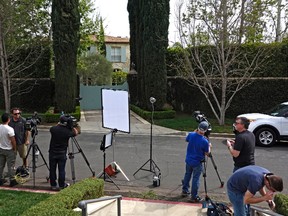 Members of the media gather at the site of the former home of O.J. Simpson on Friday, March 4, 2016, in the Brentwood area of Los Angeles. Detectives are investigating a knife claimed to have been found some time ago at the former home of Simpson who was acquitted of murder charges in the 1994 stabbings of his ex-wife Nicole Brown Simpson and her friend Ron Goldman. (AP Photo/Brian Melley)