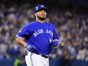 Edwin Encarnacion #10 of the Toronto Blue Jays reacts after flying out to end the third inning against the Kansas City Royals during game four of the American League Championship Series at Rogers Centre on October 20, 2015 in Toronto, Canada. (Harry How/Getty Images/AFP)
