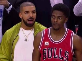 Drake chirps Bulls' Justin Holiday during Monday night's game.