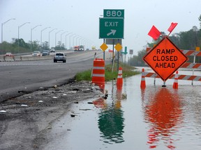 Floodwaters build up along Interstate 10 near exit 880 near Orange, Texas, Tuesday, March 15, 2016. Travelers on parts of Interstate 10 in Southeast Texas face detours due to flooding of the nearby Sabine River following recent heavy rains. (Guiseppe Barranco(/The Beaumont Enterprise via AP)