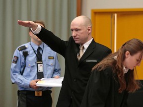 Anders Behring Breivik gestures as he enters a courtroom in Skien, Norway, on March 15, 2016. Breivik, the right-wing extremist who killed 77 people in bomb and gun attacks in 2011 arrived in court on Tuesday for his human rights case against the Norwegian government. (Lise Aserud, NTB scanpix via AP)