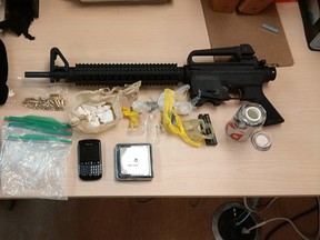 Evidence including semiautomatic rifle, cocaine, heroin, a cellphone and other drug equipment  were seized during an arrest by Kingston Police on Monday March 14 2016  . Submitted Photo/Kingston Police /The Whig-Standard/Postmedia Network